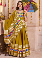 Mirror and lampi border work closeup on fluorescent green lehenga